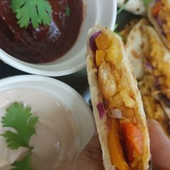 A picture of Chicken quesadilla with fajita sauce.