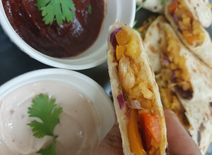 A picture of Chicken quesadilla with fajita sauce.