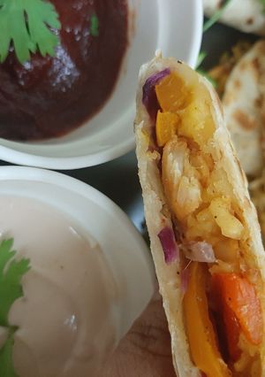 A picture of Chicken quesadilla with fajita sauce.