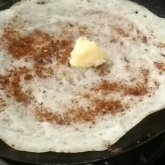 A picture of Crispy dosa in iron tawa.