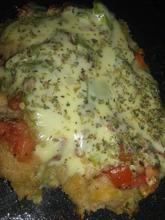 Una foto de Milanesas de muslo a la pizza