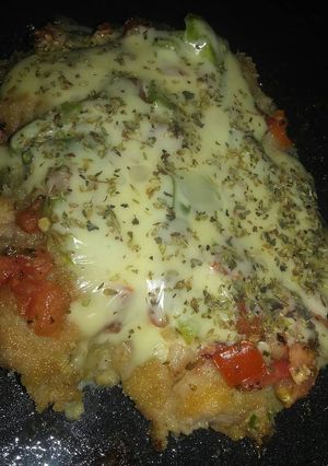 Una foto de Milanesas de muslo a la pizza