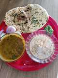 Punjabi thali (Tandoori roti with dal makhni kheere ka raita and chutney)