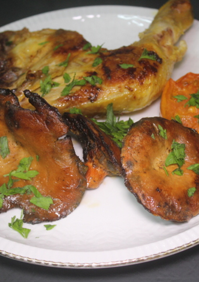 Una foto de Contramuslo de pollo con níscalos