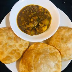A picture of Sattu ki kachori with Aloo sabji.