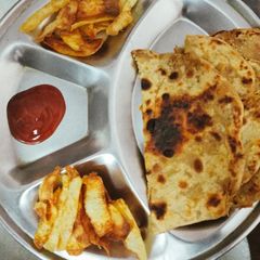 A picture of Grated raw aloo ka parathas.