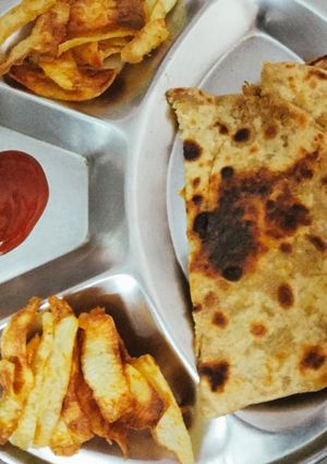 A picture of Grated raw aloo ka parathas.