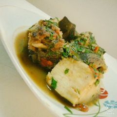 A picture of Cow leg pepper soup and yam.