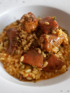 Una foto de Arroz meloso de níscalos y butifarra