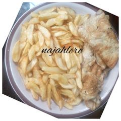 A picture of Chips and fried egg.