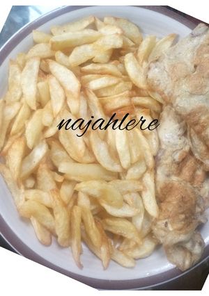 A picture of Chips and fried egg.