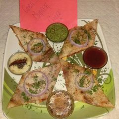 A picture of Schezwan cheese corn dosa.