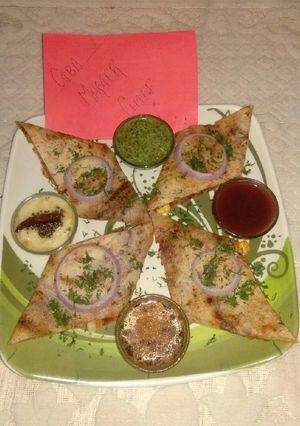 A picture of Schezwan cheese corn dosa.