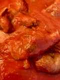 Stuffed Horse Braciole Cooked in Tomato Sauce
