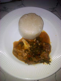 A picture of Eba with bitter leaf soup.