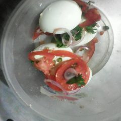A picture of Boiled eggs with kachumbari.