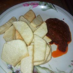 A picture of Fried yam with stew.