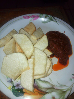 A picture of Fried yam with stew.