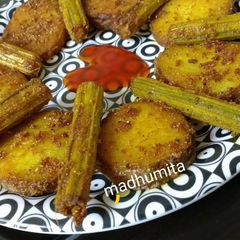A picture of Drumsticks and Potato Masala Fry.