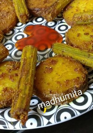 A picture of Drumsticks and Potato Masala Fry.