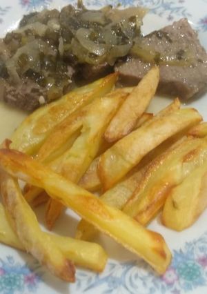 Una foto de Carne encebollada
