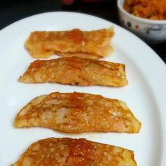 A picture of Gajar R Patisapta (Eggless Sweet Carrot Crepes Stuffed with Carrot Pudding and Served with Carrot Syrup).