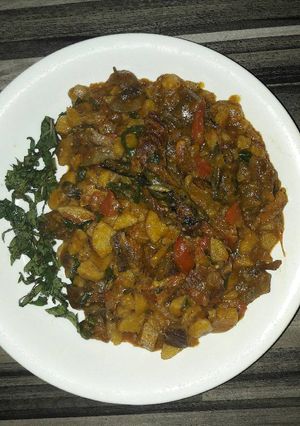A picture of Unripe plantain porridge with dryfish and pomo.