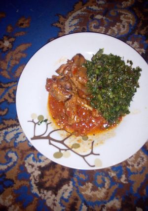 A picture of Duck stew with boiled mchicha....