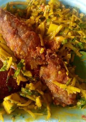 A picture of Abacha with fried fish.
