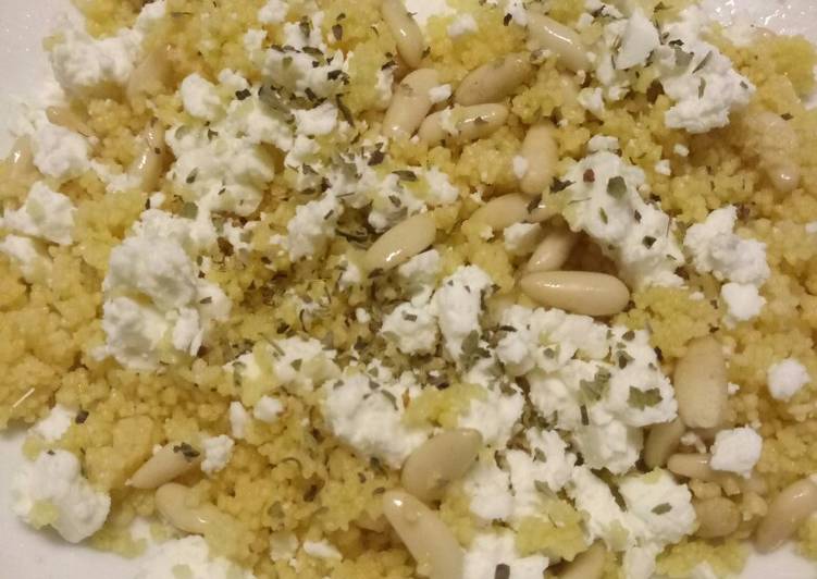 Cous cous salad with feta cheese and pine nuts
