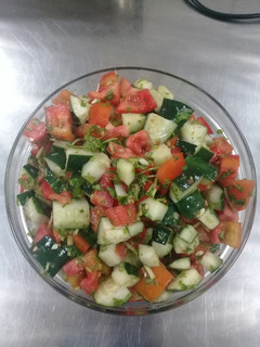 A picture of Tomato cucumber salad.
