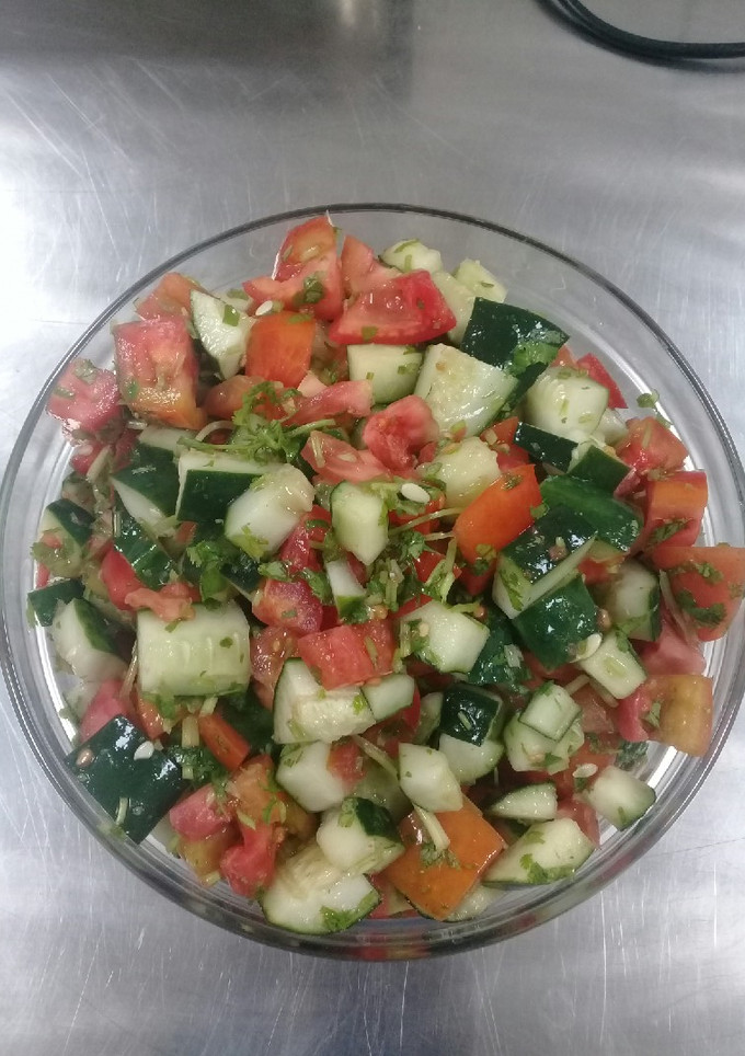 A picture of Tomato cucumber salad.