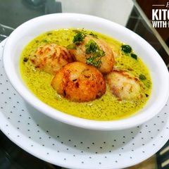 A picture of Moong Dal Appe with Peanut Curry.