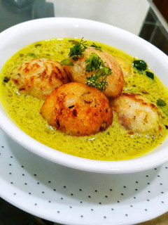A picture of Moong Dal Appe with Peanut Curry.