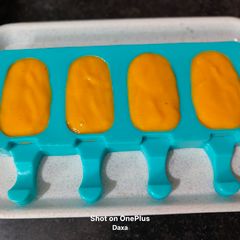A picture of Kesar Mango Yogurt Popsicles.