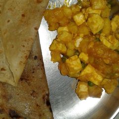 A picture of Paratha and paneer stir fry.