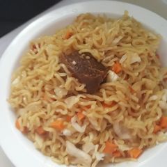 A picture of Indomine with carrots,cabbage and meat.