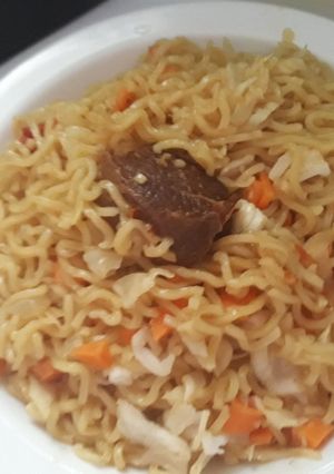A picture of Indomine with carrots,cabbage and meat.
