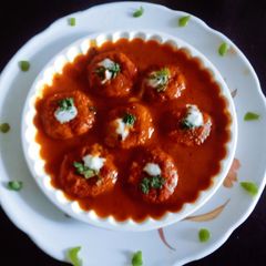 A picture of Super tasty lauki veg tikki with tomato onion gravy.