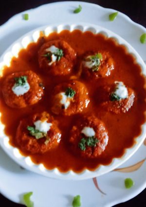 A picture of Super tasty lauki veg tikki with tomato onion gravy.
