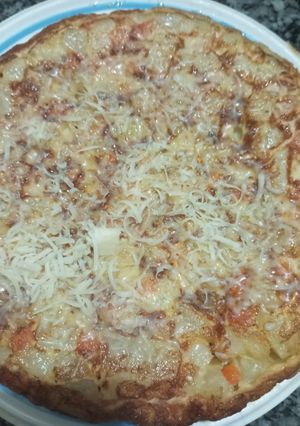 Una foto de Tortilla de papas zanahorias y brócoli sin freír