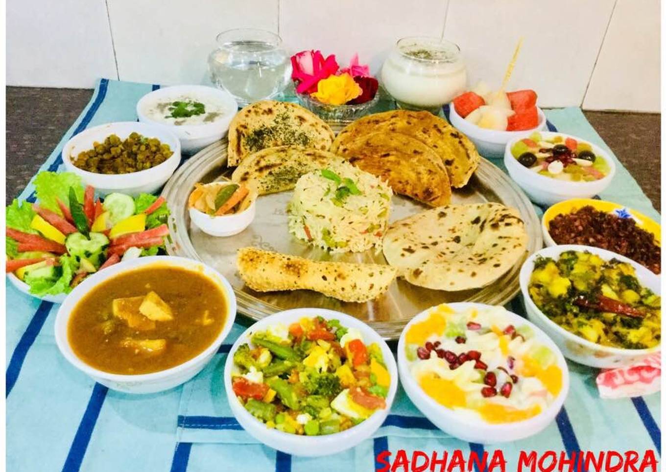 Green Channa-Cheese Curry,Methi -Aloo,Fruit Yogurt,Sautéed Veg,Mint Riata,Rice,fresh fruits,Lassi