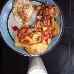 A picture of Fried yam with egg and Irish potatoes.