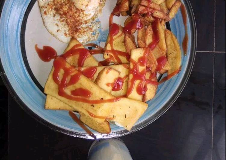 Fried yam with egg and Irish potatoes