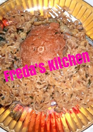 A picture of Indomie with fish and scent leaf.