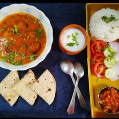 A picture of Lauki kofta, rice and roti.