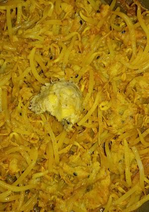 A picture of Mung bean sprouts in banana-peanut butter- tikka masala sauce.