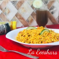 A picture of Stir fry noodles with tamarind juice.