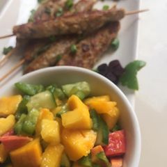 A picture of Seekh Kebabs with mango salsa.