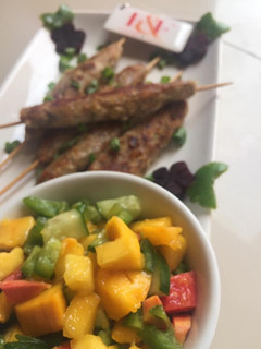 A picture of Seekh Kebabs with mango salsa.